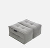 En grå, firkantet, tuftet gulvpude med en søm i midten, der ligner to forbundne sædepuder - denne Ambient Lounge Twin Ottoman bringer alsidig designer-ottoman-stil til ethvert rum.
